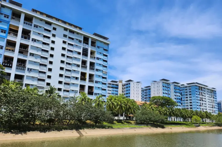 A scenic look at the Pasir Ris neighborhood, featuring its unique architectural HDB designs and coastal greenery, highlighting the relaxed, resort-like atmosphere of this East-side food destination.