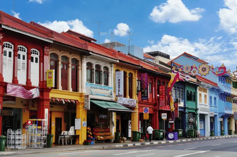 A vibrant street-level view of Serangoon, capturing the blend of heritage shophouses and modern lifestyle hubs that make it a premier destination for foodies and cafe-hoppers.