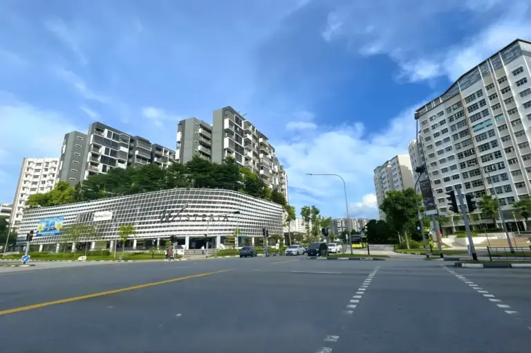 A vibrant look at the Yishun neighborhood, featuring its iconic high-rise HDB flats and community spaces that house some of the North's most popular heartland eateries.