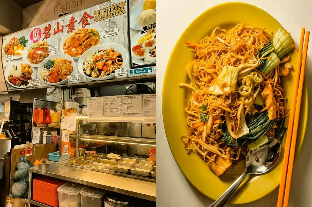 Left: A three-quarter, eye-level shot of a hawker stall named 'Bishan Vegetarian' featuring a large illustrated menu board above a stainless steel service counter with empty food inserts and nested plastic storage containers below. Right: A top-down, close-up shot of a yellow oval plate loaded with fried noodles, green bok choy vegetables, bean sprouts, sliced green chilies, and fried tofu, positioned next to orange chopsticks and a metal spoon on a white surface.