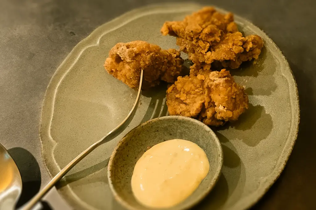 Close-up overhead shot of Japanese style fried chicken with creamy mayonnaise dipping sauce at Sio Pasta Singapore