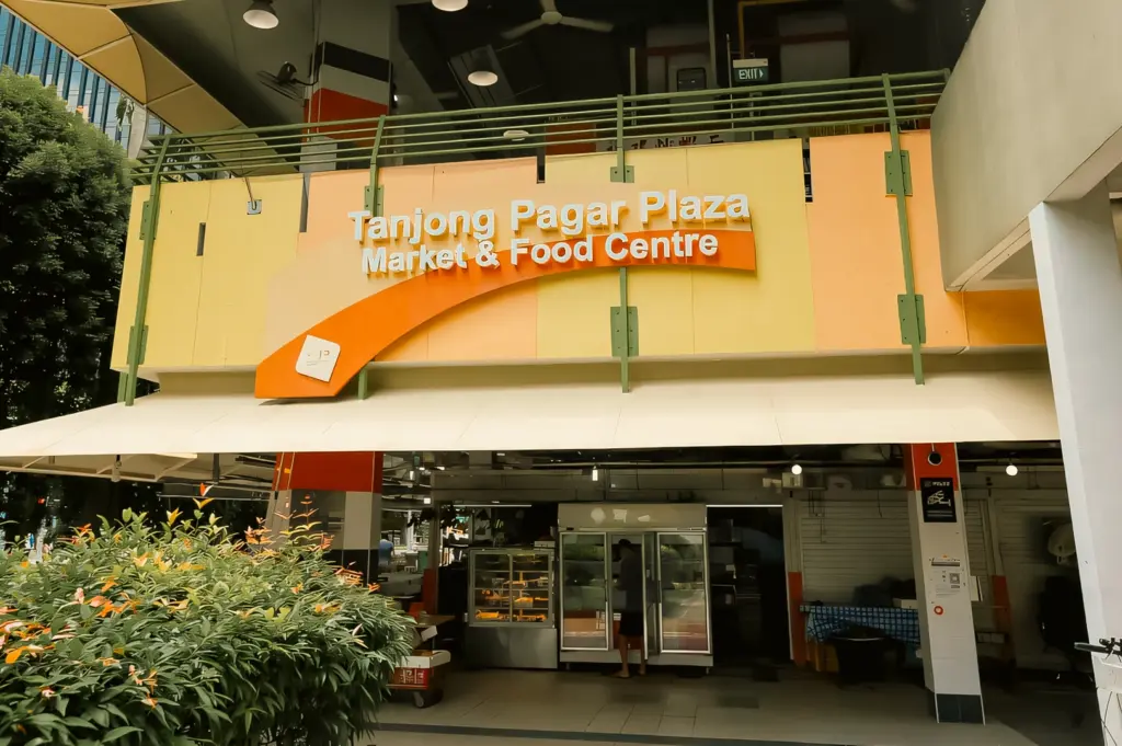 Wide-angle slightly low-angle exterior shot of Tanjong Pagar Plaza Market and Food Centre in Singapore, a popular hawker centre known for casual dining and authentic local food.