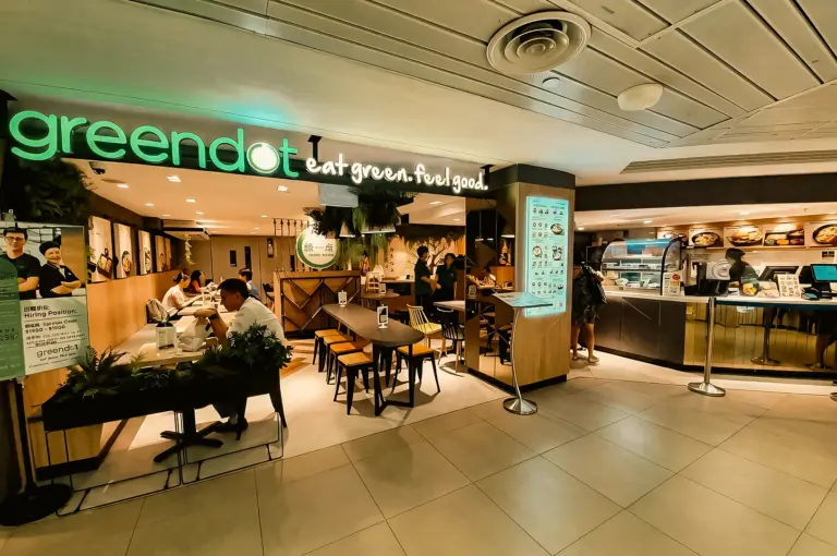 Wide-angle eye-level shot of Greendot Junction 8 restaurant in Bishan, showcasing clean modern interior and plant-based dining space in Singapore