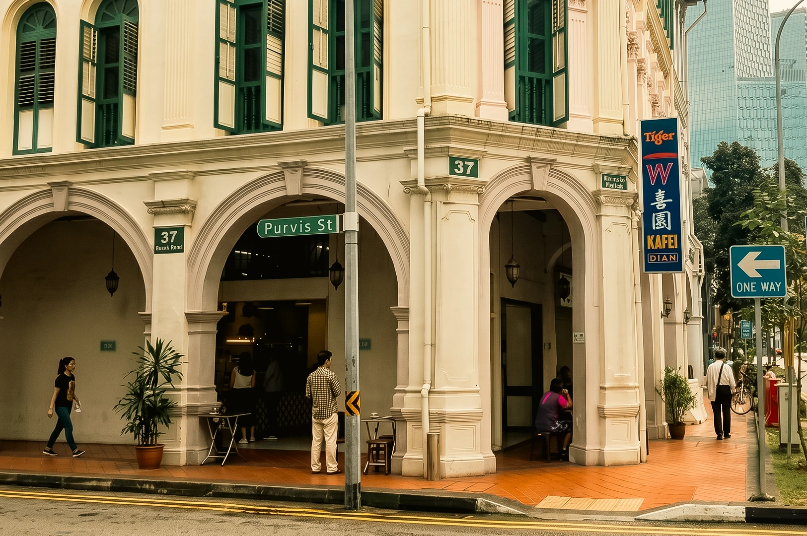 YY Kafei Dian Singapore kopitiam exterior at Beach Road Purvis Street corner with heritage shophouse architecture, street-level wide shot angle