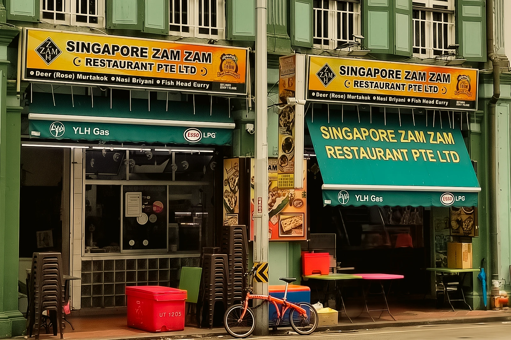 Eye-level wide-angle view of Singapore Zam Zam Restaurant on North Bridge Road in Kampong Glam, Singapore, a historic halal Indian Muslim restaurant famous for mutton murtabak, nasi briyani and traditional Singapore dining.