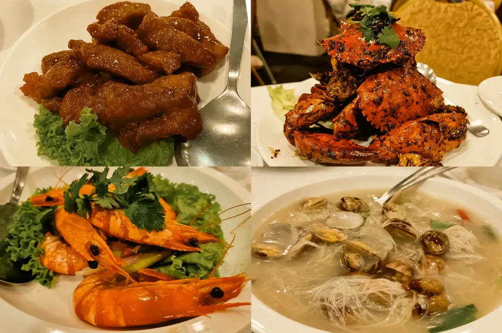 Upper Left: Close-up of glazed pork ribs on a white plate with lettuce garnish and a serving spoon. Upper Right: Close-up of a stacked crab dish with orange shells and cilantro on a white plate. Lower Left: Slightly overhead view of whole prawns on lettuce with cilantro garnish in a white serving dish. Lower Right: Close-up of clam bee hoon soup with rice vermicelli, clams, light broth, and a serving spoon