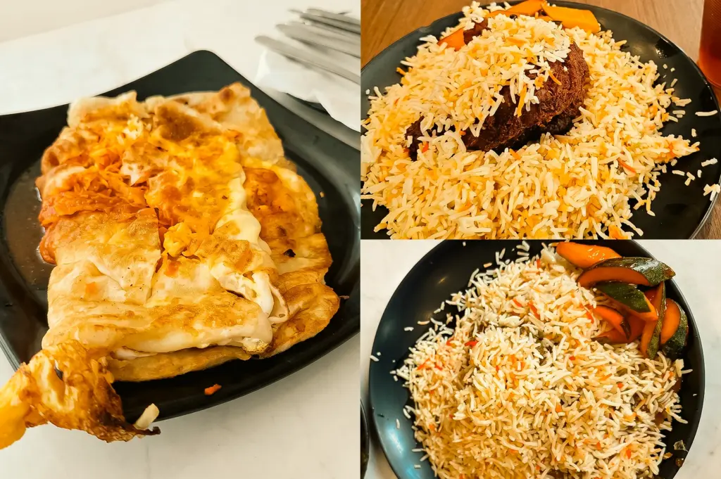 Left: Close-up, three-quarter angle view of a golden-brown murtabak on a black square plate, showing flaky folded flatbread layers, browned egg, and visible filling textures on a light-colored tabletop under warm indoor lighting. Upper Right: Top-down close-up view of a black round plate filled with long-grain briyani rice in white, yellow, and orange tones, topped with a dark-brown piece of meat, with a wooden table surface visible around the plate. Lower Right: Top-down close-up view of a black round plate containing briyani rice with scattered orange seasoning and a side of sliced pickled vegetables in orange and green hues, highlighting distinct rice grains, glossy vegetable textures, and soft indoor lighting.