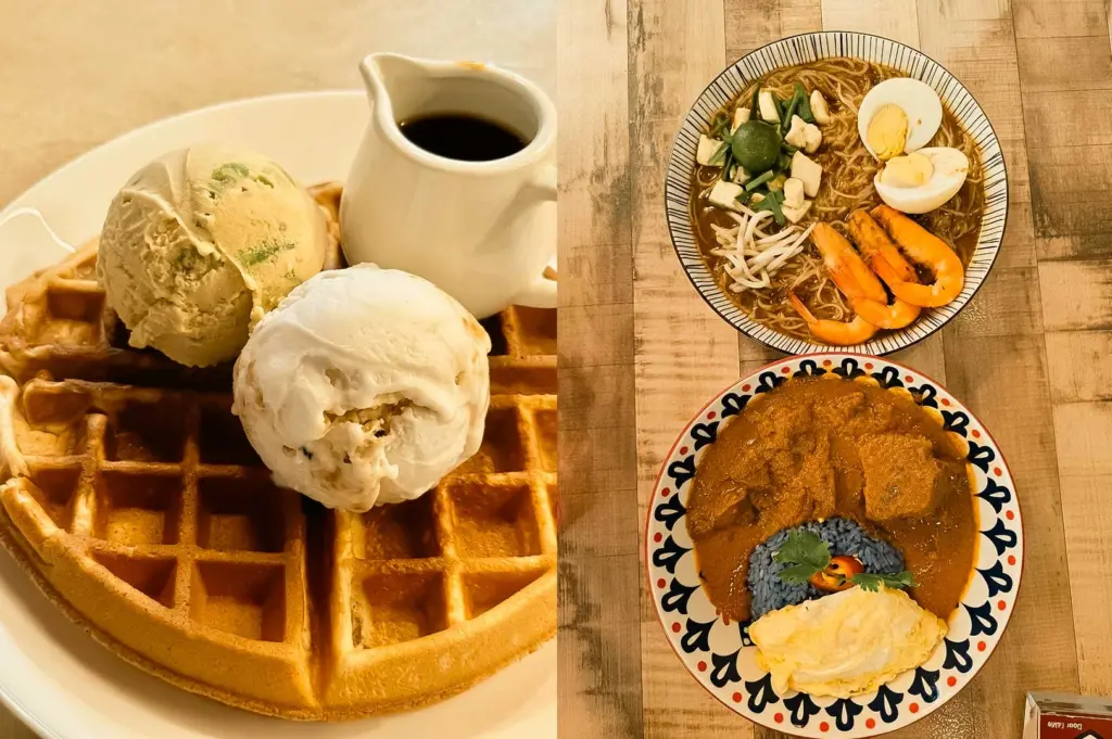 This split-screen image highlights Marie's Lapis Cafe, featuring a close-up shot on the left of a golden-brown waffle topped with two scoops of ice cream and served with a small pitcher of syrup, while the right side displays a top-down view of two dishes on a wooden table: a bowl of noodle soup topped with prawns, hard-boiled eggs, and bean sprouts alongside a patterned plate containing blue pea butterfly rice served with thick meat curry and an egg.