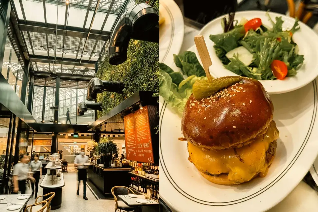 Left Panel: A high-ceilinged bistro interior featuring glass skylight roofing, an expansive green plant wall, industrial black piping details, warm orange menu boards, chic bistro seating, and waitstaff in motion across the floor. Right Panel: A close-up view of a glossy, toasted brioche cheeseburger skewered with a wooden pick holding a pickle slice, featuring melted yellow cheese oozing over a thick beef patty, served on a rimmed white ceramic plate beside a fresh side salad with cherry tomatoes.