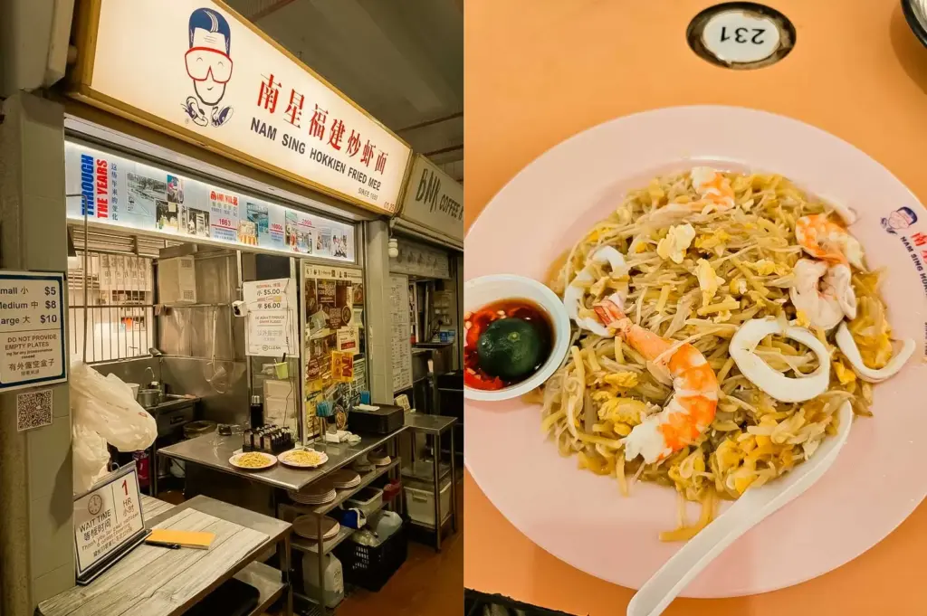 A split-screen composition featuring the hawker stall facade of Nam Sing Hokkien Fried Mee (#01-32) on the left, displaying white and red signage with an illustrated mascot, price listings, and historical photos above a stainless steel counter and waiting time sign, paired on the right with a top-down view of a pink plate filled with Hokkien fried prawn mee topped with whole prawns, squid rings, and scrambled egg, served alongside a white spoon and a small saucer with red chili and a lime half.
